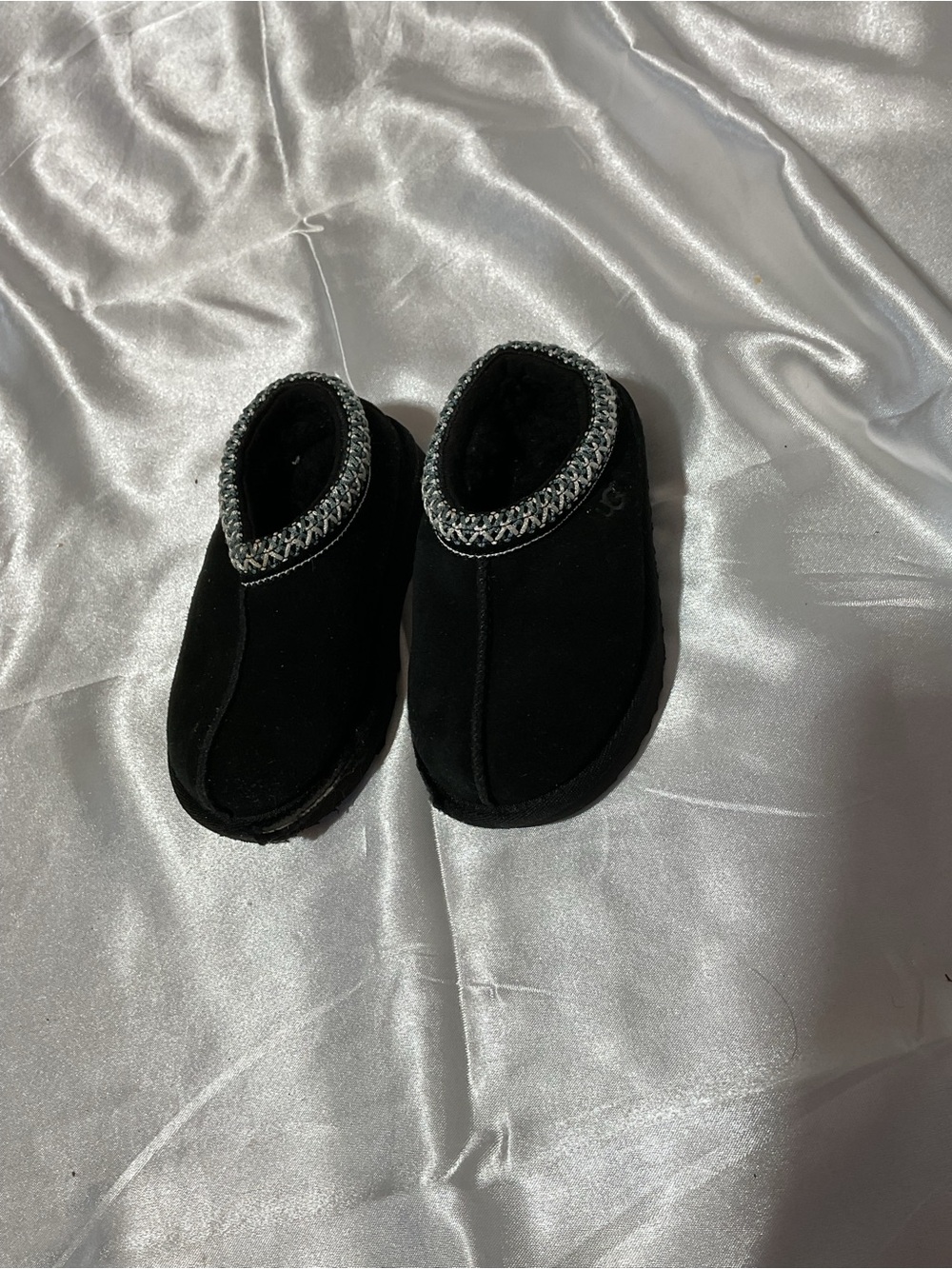 Kids Black Cozy Slip-On Shoes with Decorative Trim It is torn to shreds—heaps of